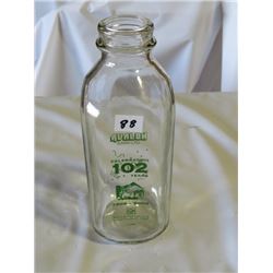 MILK BOTTLE MARKED AVALON DAIRY LTD. CELEBRATING 102 YEARS, 1906 -2006