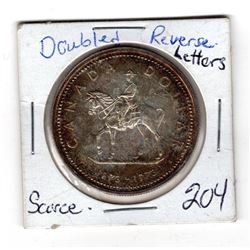 1973 RCMP COMMEMMORATIVE SILVER DOLLAR W/DOUBLED REVERSE LETTERING ERROR, SCARCE