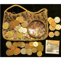 An interesting Sequined Zippered Purse with a bracelet & a variety of Foreign Coins.