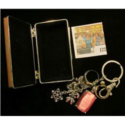 Small Silvered Jewelry Box containing a couple of rings, a Pink faceted Pendant, & a Charm Key Chain
