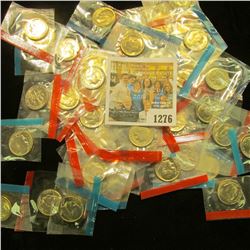 1276 _ (50) 1965-78 U.S Mint Single Roosevelt Dimes in original U.S. Mint Cellophane as cut from Min