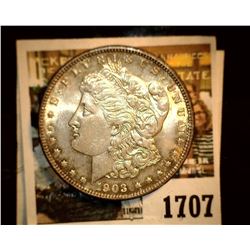 1707 _ 1903 P U.S. Silver Morgan Dollar, Choice BU 63. Gold toning.