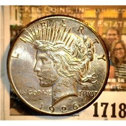 1718 _ 1926 P U.S. Silver Peace Dollar, Choice BU 64. Gold toning.