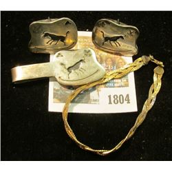 "1804	_	Sterling Silver Bracelet; Indian Design Money Clip & Cuff Links. Total weight of Sterling Si