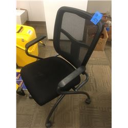 2 Black mesh office chairs on wheels
