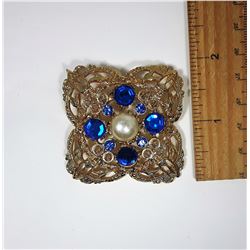10)  GOLD TONE FILAGREE BROOCH WITH