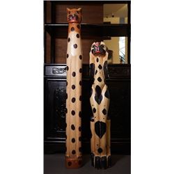 Two totem poles with "animals" pattern.