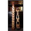 Image 1 : Two totem poles with "animals" pattern.