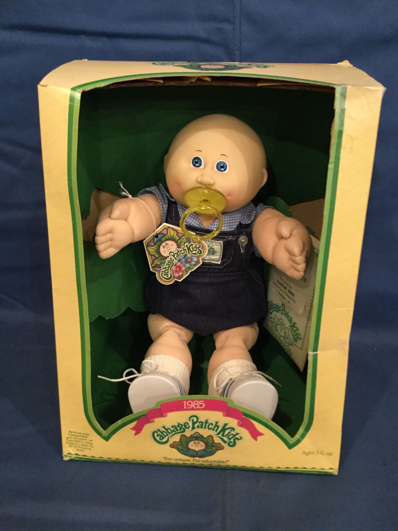 Cabbage Patch Kids box with doll and a certificateAaron Eric in a 1985 box.
