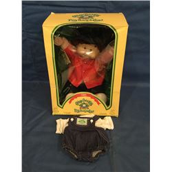 Cabbage Patch Doll in box marked 1985 P'tits Bouts de Choux and has certificate