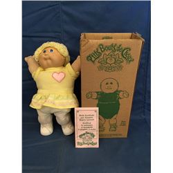 Cabbage Patch Doll in box marked  P'tits Bouts de Choux and has certificate
