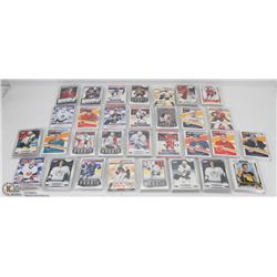 LOT OF 31 TEAM BAGS OF HOCKEY ROOKIE CARDS ,