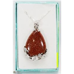 GOLD SAND TEAR DROP SHAPED PENDANT WITH CHAIN.