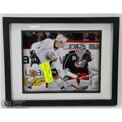 106) TAYLOR HALL FRAMED SIGNED PICTURE, NOT