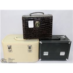 2 LEATHERETTE TRAIN CASES WITH KEYS, ONE IS