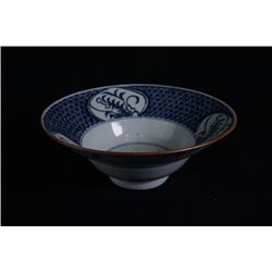 A blue-and-white "Flora" bowl.