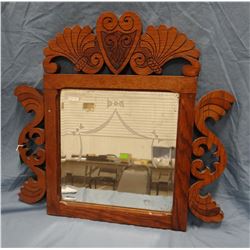 Beveled mirror in oak frame, 23" x 24"