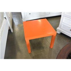 ORANGE END TABLE AND BLACK TRAVEL BAG