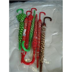 SEVEN PLASTIC UMBRELLAS