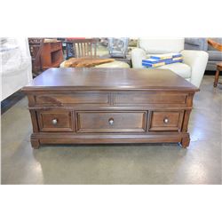 ASHLEY FLOOR MODEL LIFT TOP COFFEE TABLE WITH 3 STORAGE DRAWERS, LIGHT FINISH RETAIL $1399