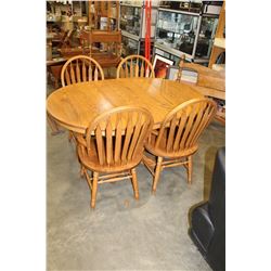 ROUND OAK DINING TABLE W/ LEAF AND 4 CHAIRS