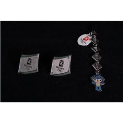 Two emblems. A decoration "Fu Wa Bei Bei".