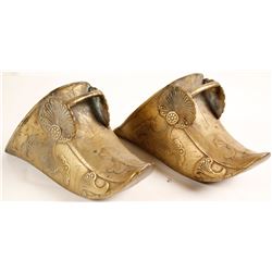 Pair of decorative brass shoes