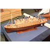 Image 1 : Two handmade wooden ships including a sailboat and a 32" ocean liner plus a three piece 6" X 9" Nati