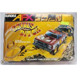 VINTAGE AURORA AFX DEVILS DITCH WITH 2 TRUCKS