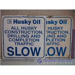 (2) Metal Husky Oils Signs