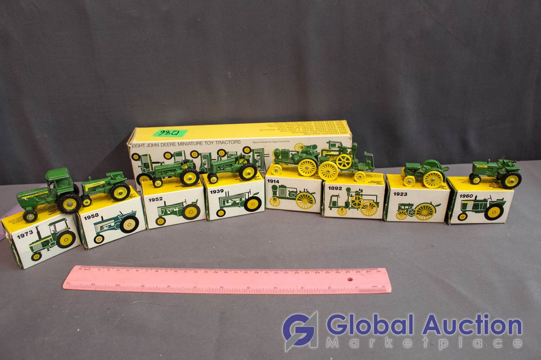 Set of (8) John Deere Miniature Metal Toy Tractors (all in Box)