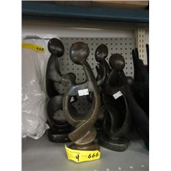 4 Carved Stone Statues