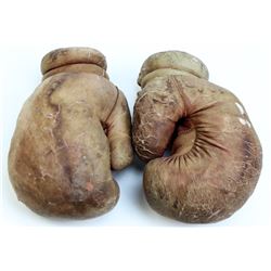 Old pair leather boxing gloves,