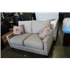 Image 1 : NEW ASHLEY FURNITURE BEIGE CONTEMPORARY LOVE SEAT W/ NAILHEAD ACCENT - RETAIL $1,299
