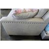Image 2 : NEW ASHLEY FURNITURE BEIGE CONTEMPORARY LOVE SEAT W/ NAILHEAD ACCENT - RETAIL $1,299