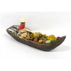 Ecuadorian Pottery Vendor in Canoe