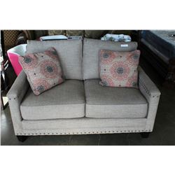 NEW ASHLEY FURNITURE BEIGE CONTEMPORARY LOVE SEAT W/ NAILHEAD ACCENT - RETAIL $1,299