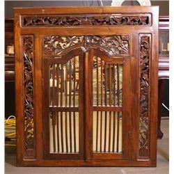 An early 20th century wood carved mirror.