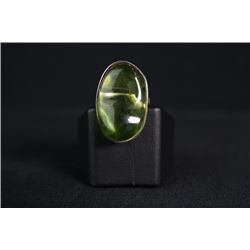 A Green Amber Ring Inlaid with 925 Silver.