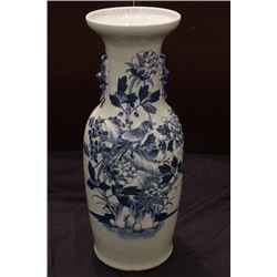 A celadon-glazed blue-and-white "birds and flowers" vase with two ears.