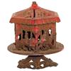 Image 1 : Merry-Go-Round cast iron bank, revolves on fancy base, has original red & gold paint & original clos