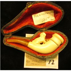 "Warranted Genuine Meerschaum" miniature pipe in pipe case. Small dog on stem proximal to bowl.