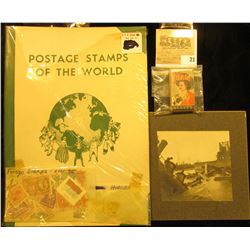 Album "Postage Stamps of the World" with stamps & hinges.; B & W mounted photo of a Rail Road Bridge
