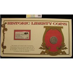 1877 P Seated Liberty Quarter. Mounted in a "History Liberty Coins" special holder with a "Preamble 