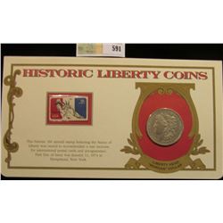 1921 P Morgan Silver Dollar. Mounted in a "History Liberty Coins" special holder with a "Statue of L