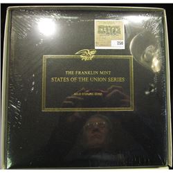 Leather Bound "The Franklin Mint States of the Union" Album with eising glass sleeves and an illustr