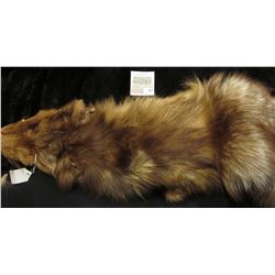 Cross Fox hide. Tanned and turned into leather with fur on. Ready for the Rendevous.