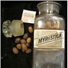 Image 2 : Large 10" x 3 1/4 Apothcary Jar with glass Stopper, some contents included.  Labeled "Myristica".  A