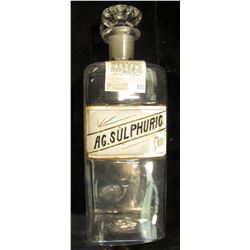 Large 12 1/2" x 4 1/4" Clear Glass Apothecary Jar with label "AG. Sulphuric" and glass stopper. Chip