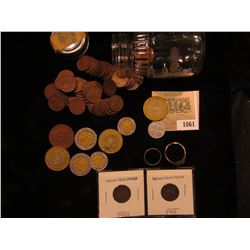 1061 _ (59) 1930 era Wheat Cents in a baby food jar; (2) Indian Head Cents; "Good Luck" Token; (8) M
